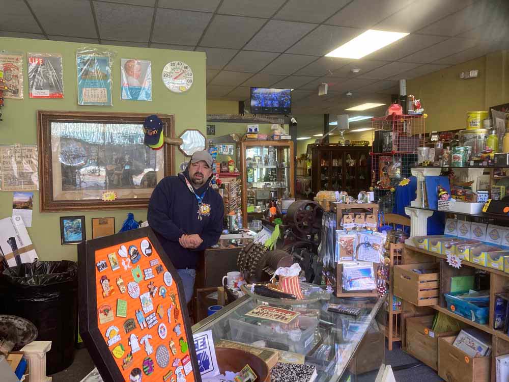 Interior view of TNT CO OP MALL with a variety of memorabilia, vintage items, and crafts.